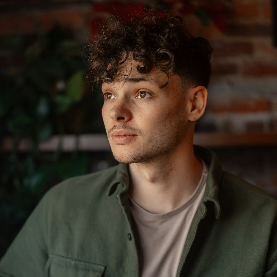 Portrait of a young video producer man in a casual jacket