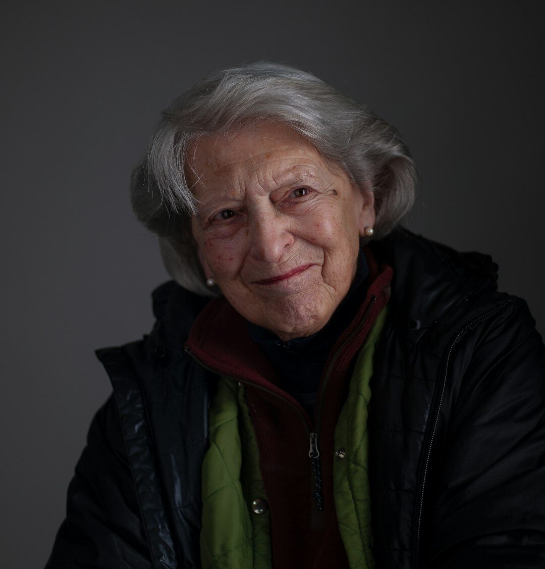 Portrait of a white haired senior editor woman